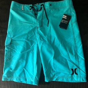 Brand new swim trunks. 2 pairs! Blue and pink.